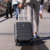 Man walking with Aerolite suitcase on bridge