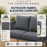 Gray outdoor sofa with 'Olsen & Smith' branding and product features highlighted.
