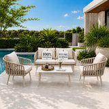 Outdoor patio set with chairs and a table by a pool